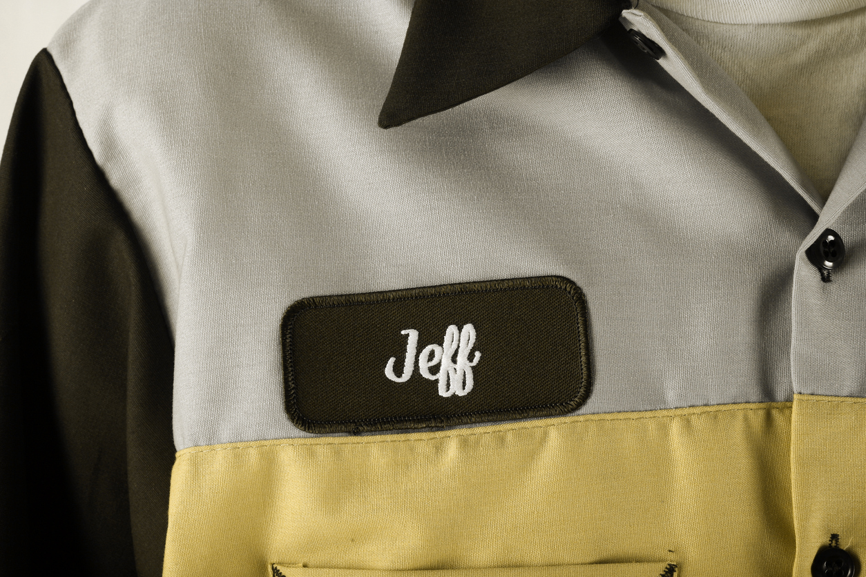 Custom branded uniforms with Blue collar name badge.