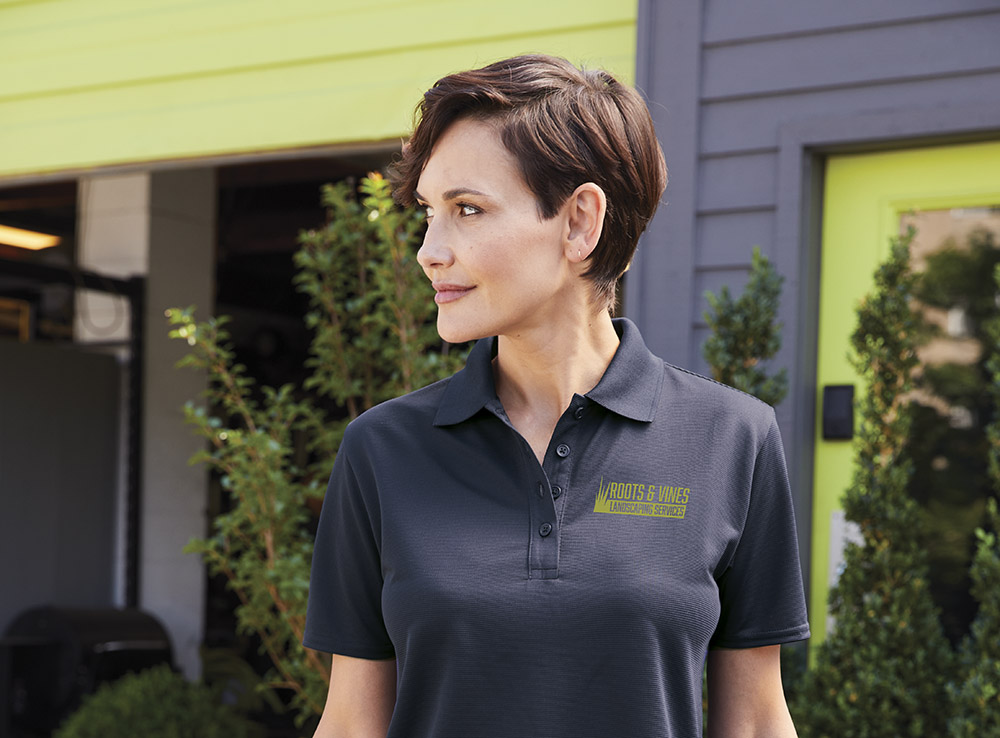 Woman wearing custom designed branded polo shirt