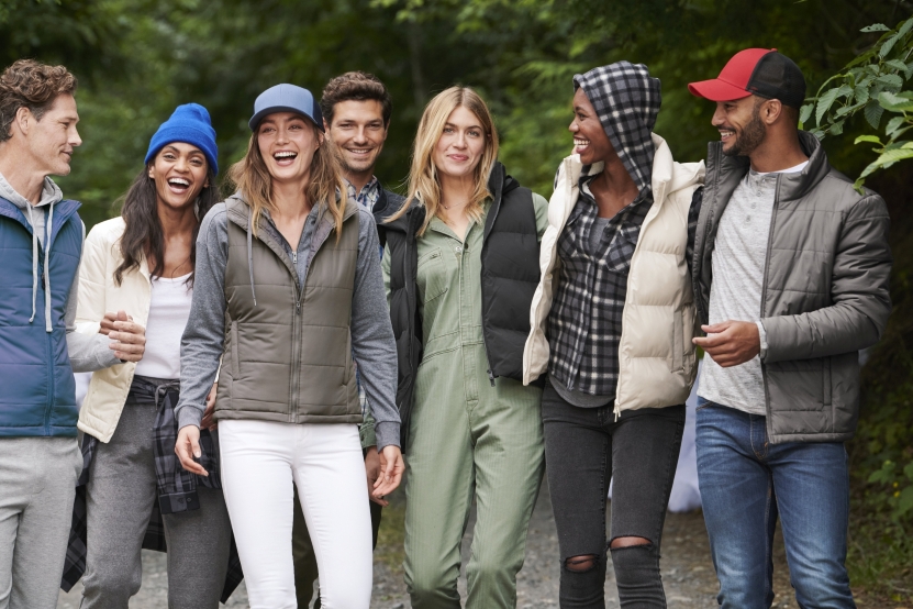 Righteous Clothing Agency insulated vests and jackets worn by a diverse team walking together outdoors.