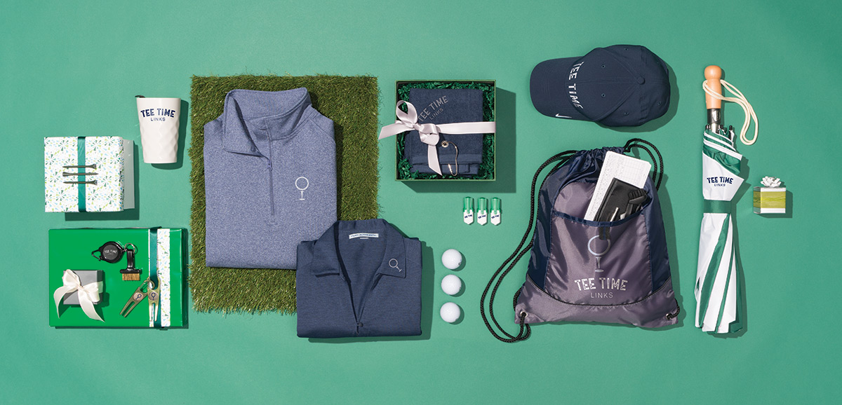  Righteous Clothing Agency golf-themed corporate gift set with quarter-zips, cap, drawstring bag, umbrella, and tees.