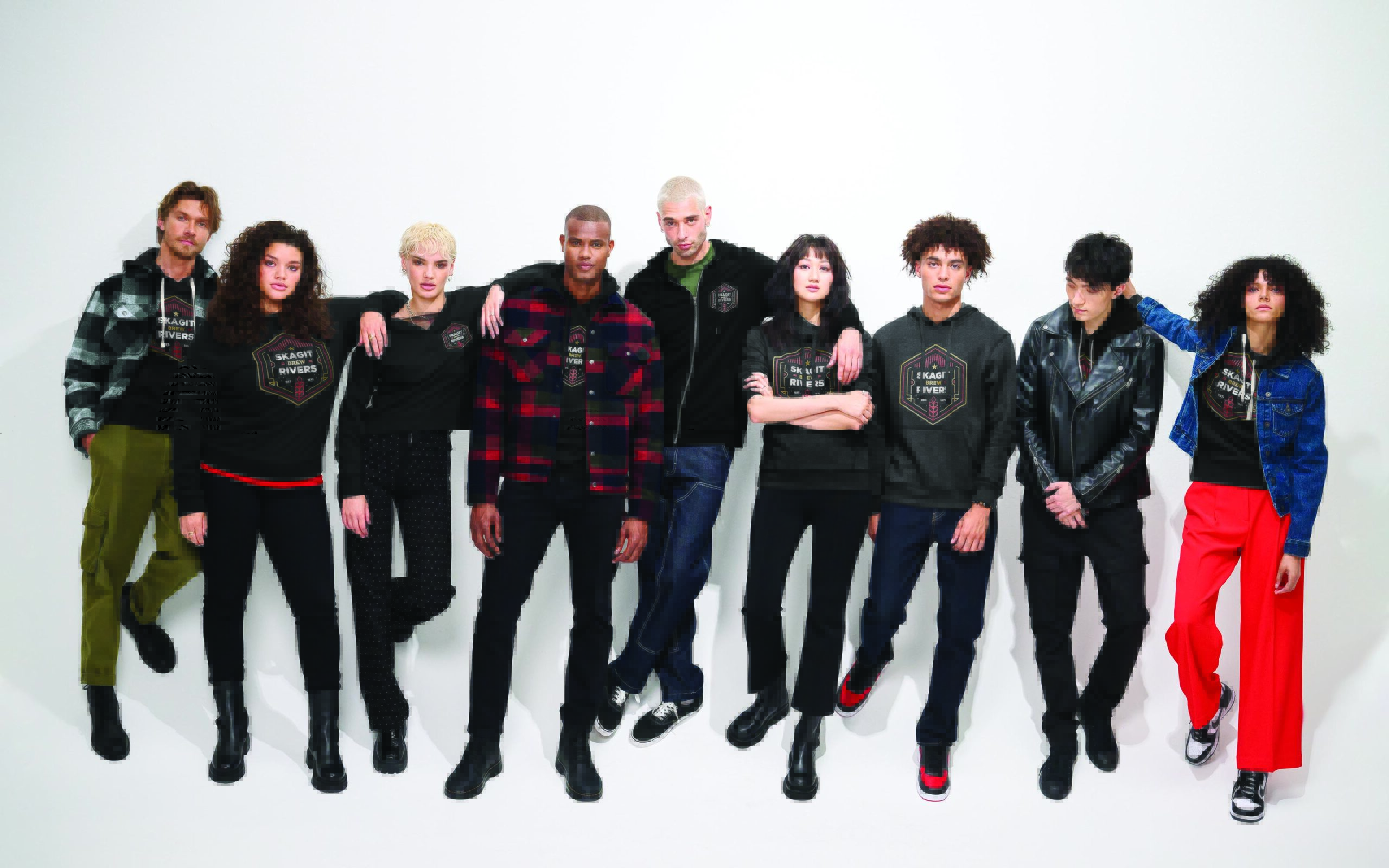 Diverse group of models wearing merchandise from Righteous Clothing Agency in a studio fashion lineup.
