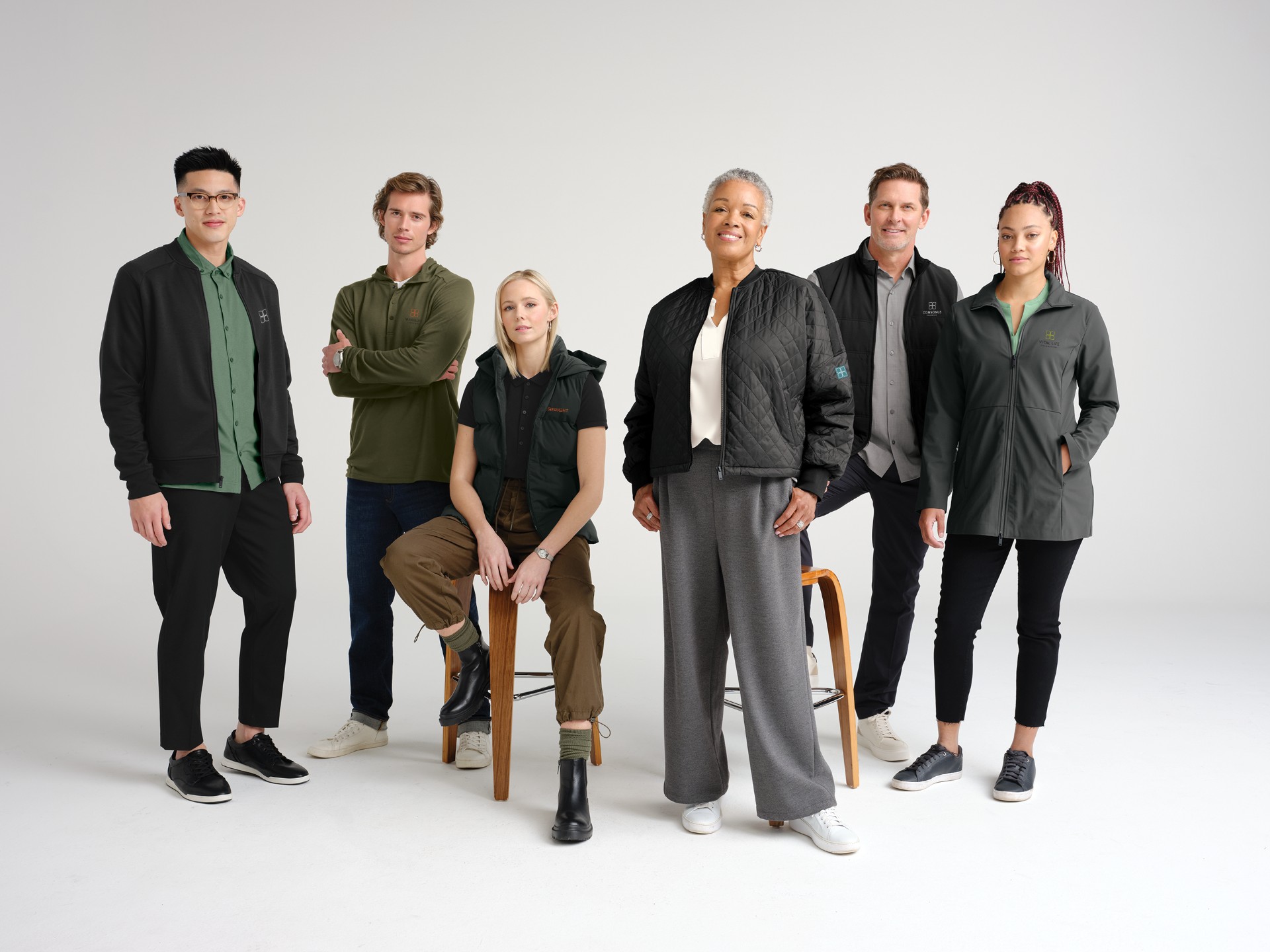 Righteous branded outerwear and polos worn by six team members in a studio. 