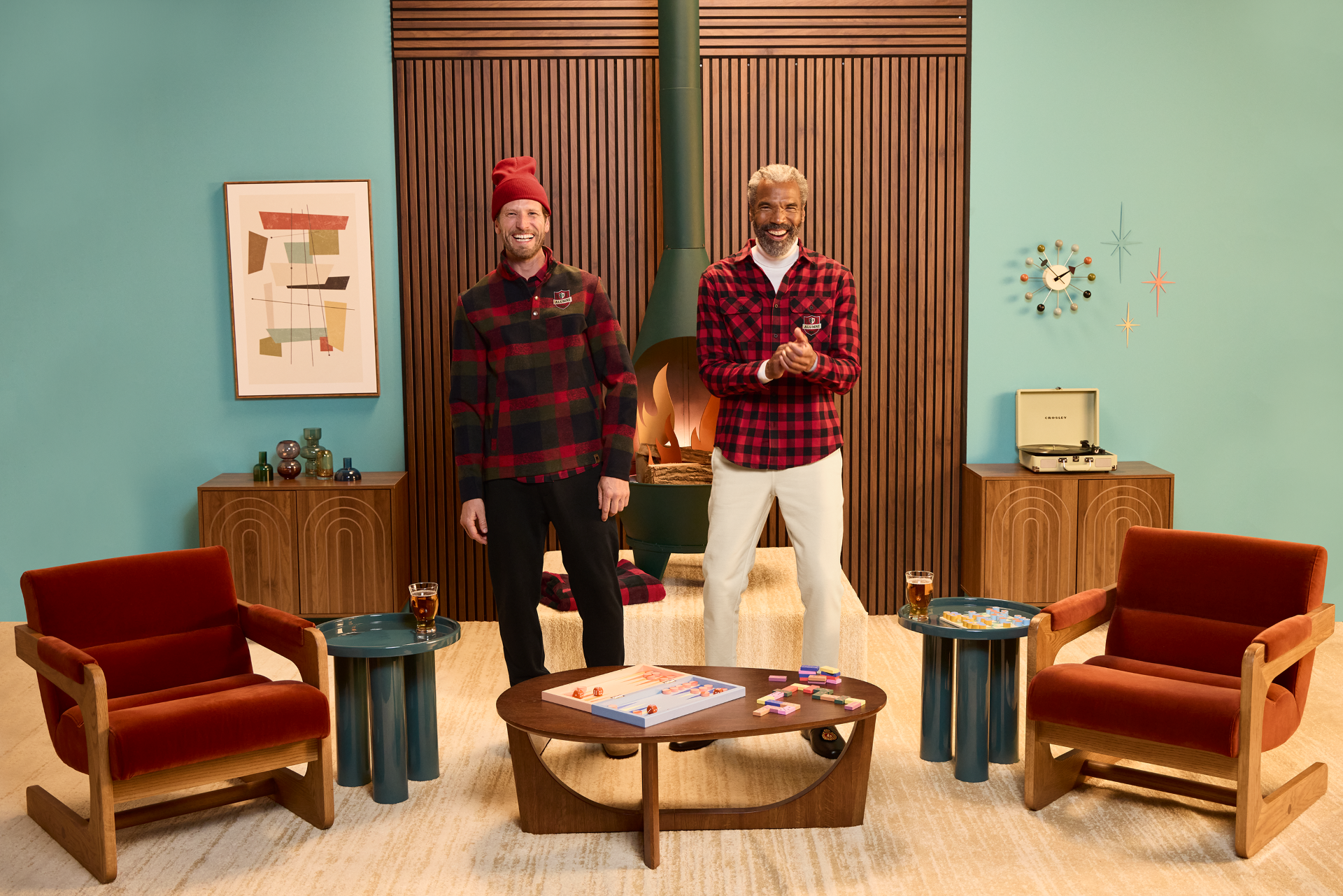 Righteous branded plaid flannel shirts worn by two men in a retro lounge setting. 