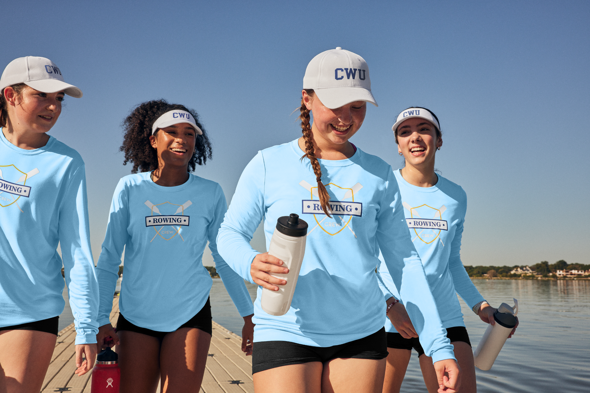 Rowing crew in light blue performance shirts supplied by Righteous Clothing Agency.